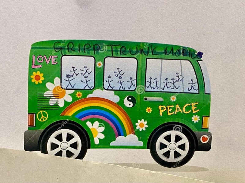 A child's drawing of a truck with a peace sign and rainbow