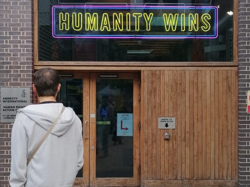 Humanity Wins sign on the front of Amnesty International HQ